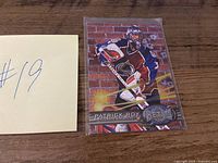 Front of Patrick Roy Fleer Metal Universe hockey card in sleeve