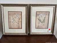 Both framed prints side by side showing artwork, frames, matting
