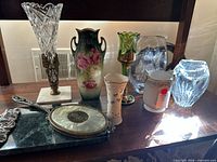 Group shot of all vases and vanity box on shelf