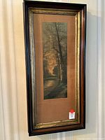 Full view of framed artwork on wall