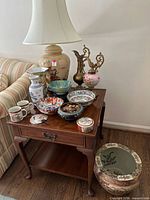 Overall lot on side table showing lamp, vases, bowls, ewers, mugs, dish