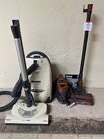 Overall view of both vacuums and accessories