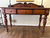 Front view of carved solid wood sideboard buffet