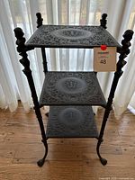 Full view of three-tier cast iron table