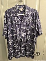 Front view of Joe Fresh purple floral Hawaiian shirt on hanger