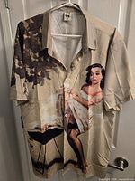 Front of beige Hardaddy short sleeve shirt with pin-up graphic