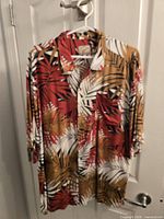 Front view of Cabana Joe tropical print shirt on hanger