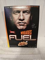 Front view of Peyton Manning Wheaties Fuel box showing portrait, branding and weight