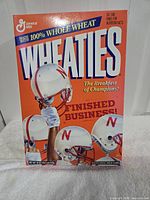 Front of Nebraska Orange Bowl Wheaties box showing helmets and slogan