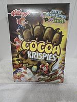 Front panel of sealed Cocoa Krispies box showing Creepy Glowing Stickers promotion