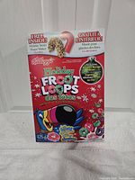 Front of Kellogg's Holiday Froot Loops Holiday box showing graphics, weight, condition