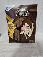 Front view of sealed Count Chocula Haunted Hideaway cereal box