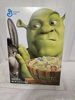 Front view of Shrek cereal box showing characters and product details