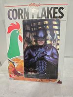 Front of Kellogg’s Corn Flakes box with rooster graphic and attached Batman 3-D card
