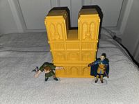 Closed yellow cathedral playset with two figurines front view