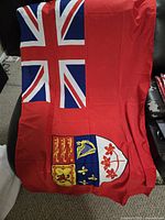 Unfolded Canadian Red Ensign flag showing design and colours