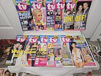 Lot overview showing all ten Inside TV magazines laid out