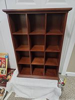 Front view showing nine cubbies and finish