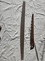 Both saws laid flat showing full lengths