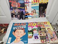 Group shot of eight MAD magazines laid out