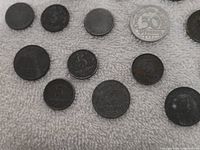 Partial view of assorted coins including 50 Pfennig 1921