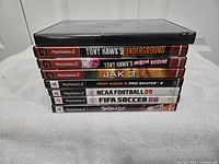 Stack of game spines showing seven titles