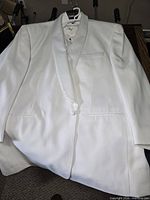 Front view of white tuxedo jacket with shirt visible
