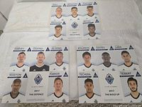 Front view of all three uncut trading-card sheets