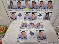 All three uncut trading card sheets laid out