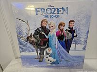 Front cover of Frozen The Songs sealed vinyl