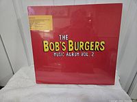 Front of sealed red box showing title graphics