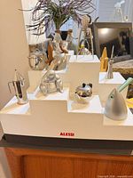 Overall view of all miniatures on stepped Alessi stand