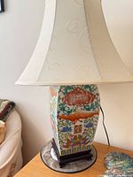 Full view of lamp with shade on wood base