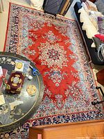 Full view of red medallion floral oriental rug on floor