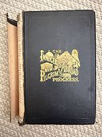 Front cover showing gilt title and black cloth