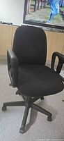 Front view of black fabric office chair showing seat, backrest and arms