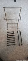Towel stand with all ten black pulls laid out