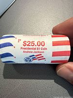 Side view of sealed roll showing printed denomination, series, president name and P mint mark