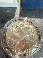 Obverse of 2008-S Bald Eagle commemorative half dollar in capsule