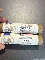 Two unopened U.S. Mint rolls showing "Lincoln Cent Formative Years" labels and 2009 date
