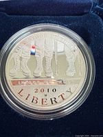 Obverse of encapsulated 2010 W proof coin inside velvet case