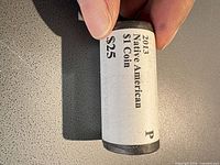 Paper-wrapped roll labeled "2013 Native American $1 Coin $25 P"