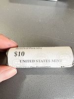 Full view of sealed $10 United States Mint quarter roll