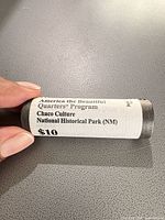 Side view of sealed roll showing printed wrapper with design name and P mint designation