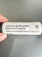 Wrapper of Denver roll showing program name, site, $10 value and mint mark D