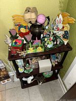 Full view of three-tier shelf with assorted Easter decorations