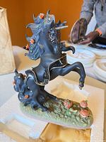Full view of unicorn figurine on foam
