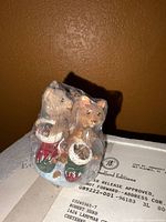 Two kittens in stockings figurine wrapped in plastic
