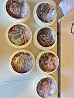 Top-down view of all eight plates in foam packaging