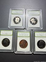 Five slabbed Kennedy Proof Half Dollars